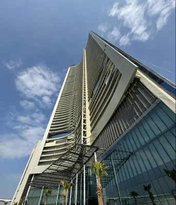 a tall building with a spiral at DAMAC Maison AYKON City C 3 Bedrooms Walk to Metro Sleeps 8 in Dubai
