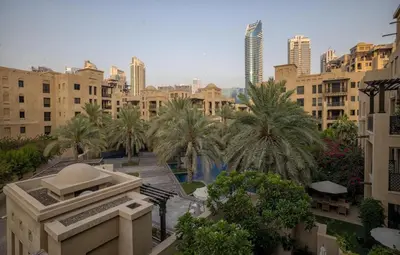 a view of a city with palm trees and buildings at Downtown Zaafaran 2, in Dubai