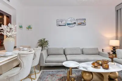 a living room with a couch and a table at Downtown Zaafaran 2, in Dubai