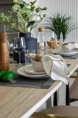 a wooden table with a plate of food on it at Frank Porter - Creek Crescent Tower in Dubai