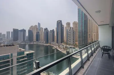 a balcony with a view of a river and buildings at Frank Porter - Silverene Towers A in Dubai