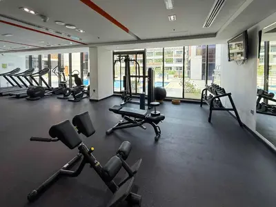 a gym with a bunch of exercise equipment in it at Frank Porter - National Bonds Residence in Dubai