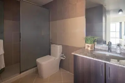 a bathroom with a toilet and a sink at Frank Porter - Churchill Residence Tower 2 in Dubai