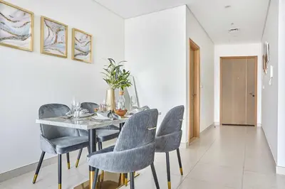a dining room with a table and chairs at Frank Porter - The Bay in Dubai