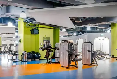a gym with several exercise equipment in a room at Rimal 5, JBR - 3 Bedroom with Maid's Room Apartment - Allsopp & Allsopp in Dubai