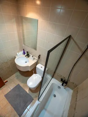 a bathroom with a sink and a toilet and a tub at Stunning 2bd marina views prime location high floor in Dubai