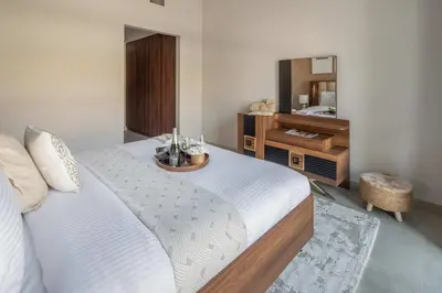 a bedroom with a large bed and a mirror at Frank Porter - Eleganz 5 By Danube in Dubai