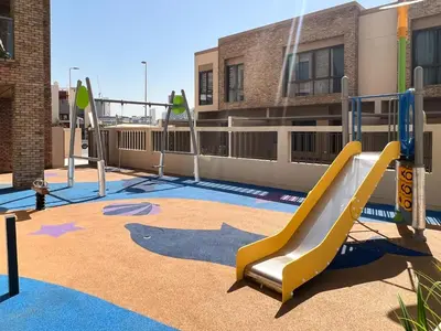 a playground with a slide in a building at Frank Porter - Eleganz 5 By Danube in Dubai