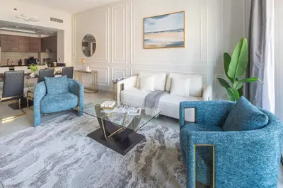 a living room with a couch and two chairs at Frank Porter - Eleganz 5 By Danube in Dubai