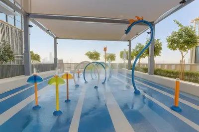 an empty swimming pool with colorful water slides at New 2 Br Burj View Vida Dubai Mall Direct Access in Dubai