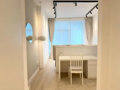 a dining room with a table and a chair at Marina Luxury 2 Bedroom Boutique Apartment in Dubai