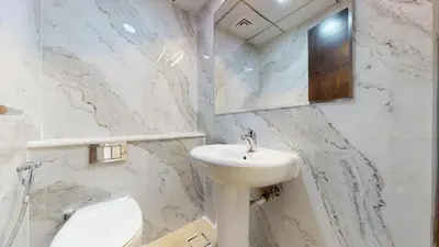 a bathroom with a sink and a toilet at Vacationer l 1 Bedroom Stunning Marina Skyline l Free Pool, Gym Access in Dubai
