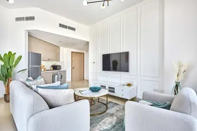 a living room with two couches and a tv at Frank Porter - Azizi Park Avenue in Dubai