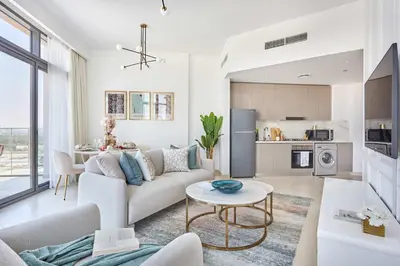 a living room with a couch and a table at Frank Porter - Azizi Park Avenue in Dubai