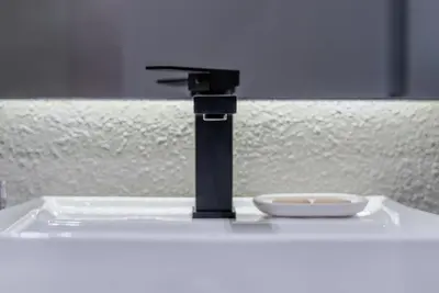 a water faucet with a bowl on a table at TRPS - MAG EYE 970, MBR - Modern and Cozy Studio, Furnished, MBR Living in Dubai