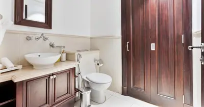 a bathroom with a toilet and a sink at Downtown 2BHK Iconic Burj Khalifa Views in Dubai