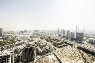 an aerial view of a city with tall buildings at Bloomfields Cozy Stu Damac Ghalia Jvc in Dubai