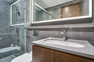 a bathroom with a sink and a shower at STAY BY LATINEM Luxury 1BR Holiday Home CC 3313 Near Burj Khalifa in Dubai