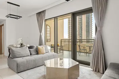 a living room with a couch and a table at VayK - Spacious 2BR in Dubai Creek Harbour in Dubai