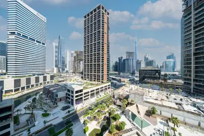 an aerial view of a city with tall buildings at Peninsula Five Luxurious Business Bay Studio in Dubai