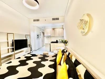a small living room with a black and white rug at Karama Apple building in Dubai