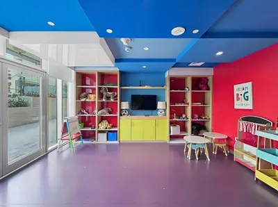 a room with colorful furniture and a blue ceiling at Beautiful Canal View Majestine Damac in Dubai