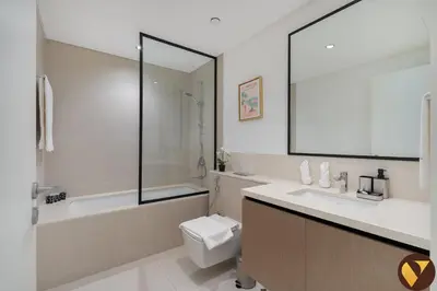 a bathroom with a sink and a toilet and a tub at Vogue Downtown Burj Crown near Burj Khalifa and Dubai Mall, Three Bedroom plus Kids Room Apartment with Large Balcony and Skyline view, Access to all Amenities in Dubai