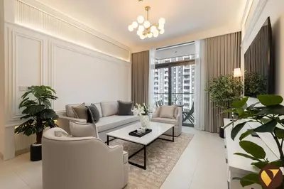 a living room with a couch and chairs and a table at Vogue Downtown Burj Crown near Burj Khalifa and Dubai Mall, Three Bedroom plus Kids Room Apartment with Large Balcony and Skyline view, Access to all Amenities in Dubai