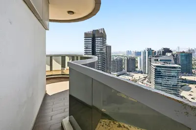 a balcony with a view of a city at Modern Luxury 2BR Apartment In Dubai Sports City in Dubai