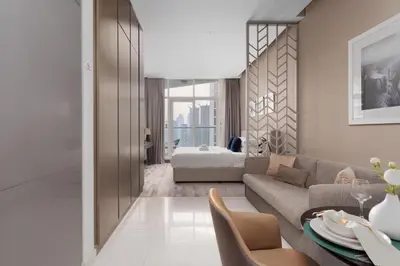 a living room with a couch and a table at GuestReady - Studio l Canal Views | Business Bay in Dubai