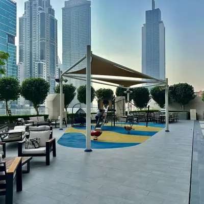 a pavilion with a playground in a city with buildings at Boulevard Heights Downtown Perfect Location High floor Luxury Apartment! in Dubai