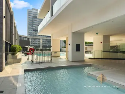 a swimming pool in the middle of a building at Burj Khalif View from Bedroom - Millionaire Residence in Business Bay Dubai in Dubai