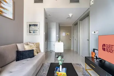 a living room with a couch and a table at GuestReady - 1BR l Canal View | Business Bay in Dubai