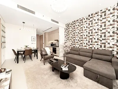 a living room with a couch and a table at Vida Residence Dubai Mall by Propigo in Dubai