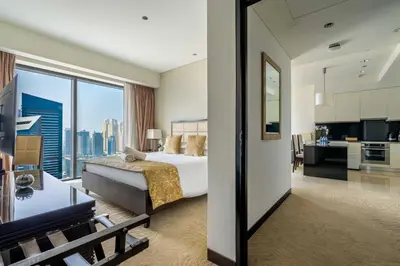 a hotel room with a bed and a large window at Marina Views & 5-Star Comfort Dubai Marina in Dubai