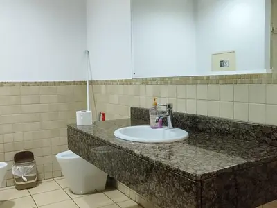a bathroom with a sink and a toilet at Dubai Beach Living JBR Hostel in Dubai