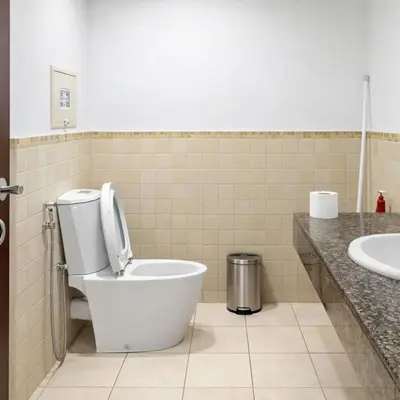 a bathroom with a toilet and a sink at Dubai Beach Living JBR Hostel in Dubai