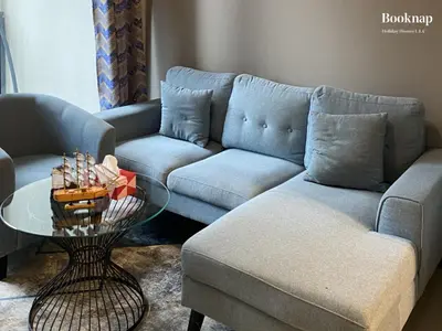 a living room with a couch and a table at Luxury Stay at Zada Tower 1BHK in Business Bay in Dubai