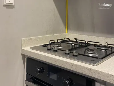 a stove top oven sitting in a kitchen at Luxury Stay at Zada Tower 1BHK in Business Bay in Dubai