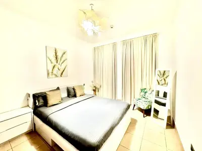 a bedroom with a bed and a window at Downtown close to Dubai mall in Dubai
