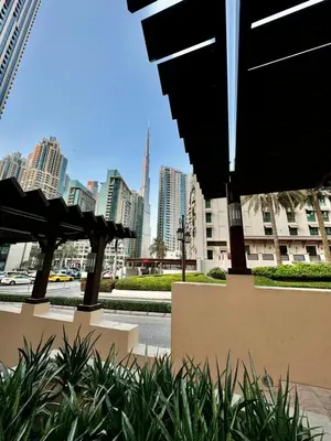 a view of a city with tall buildings and umbrellas at Downtown close to Dubai mall in Dubai