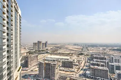 an aerial view of a city with tall buildings at STAY BY LATINEM Luxury 1BR Holiday Home CB 3813 Near Burj Khalifa in Dubai