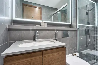 a bathroom with a sink and a mirror at STAY BY LATINEM Luxury 1BR Holiday Home CB 3602 Near Burj Khalifa in Dubai