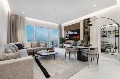 a living room with a couch and a table at La Brisa Exclusive 3BHK at 1JBR Sea Palm Royal Atlantis Burj AlArab View with Private Beach and Pool By La Brisa Dubai in Dubai