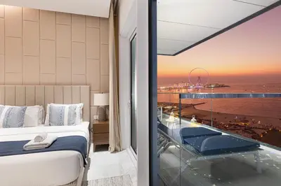 a hotel room with a view of the ocean at La Brisa Exclusive 3BHK at 1JBR Sea Palm Royal Atlantis Burj AlArab View with Private Beach and Pool By La Brisa Dubai in Dubai
