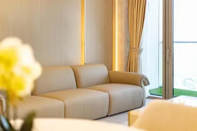 a living room with a couch and a window at Stunning Burj View High Floor EB in Dubai