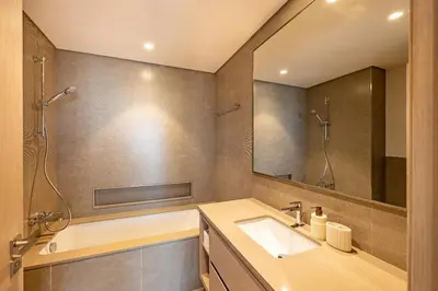 a bathroom with a sink and a mirror at Stunning Burj View High Floor EB in Dubai