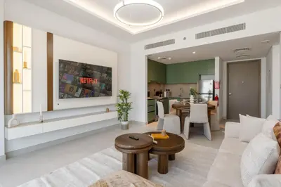 a living room with a couch and a table at Elegant 1 Bedroom with Balcony in City Walk in Dubai