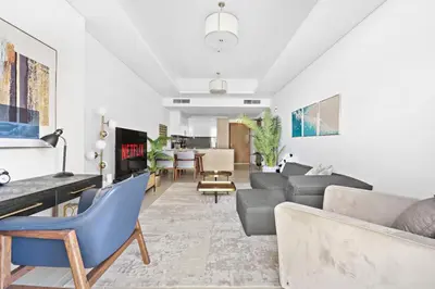 a living room with a couch and chairs at VayK - Luxurious 2BR on the Palm with Private Beach Access in Dubai