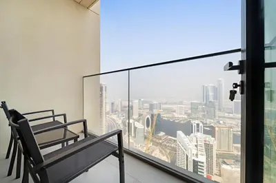a balcony with a view of a city at VayK - Stylish 1BR in Iconic Downtown Location in Dubai